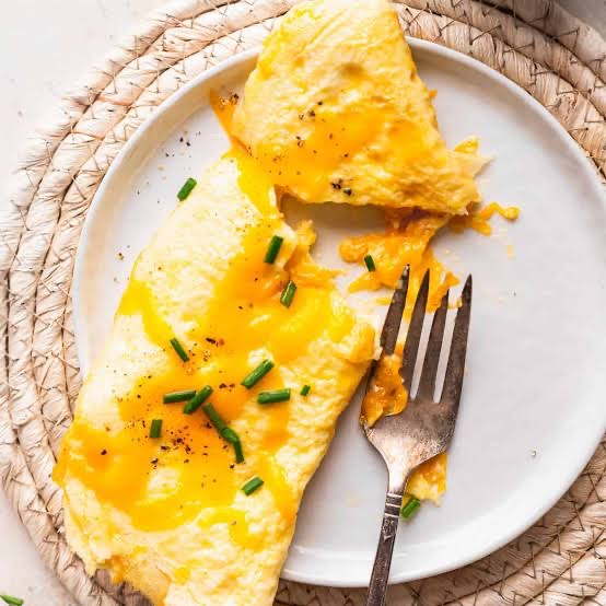 Fluffy cheddar omelet topped with fresh chives